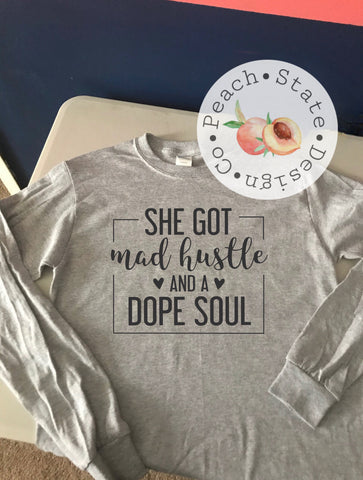 She got mad hustle & a dope soul tee